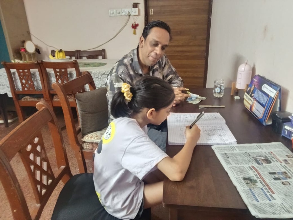 Mr. Deepak Gupta teaching a student
